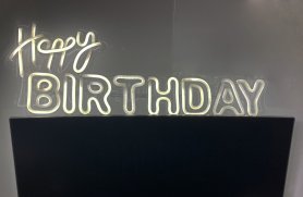Happy BIRTHDAY logo - LED neon sign on the wall hanging