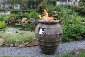 Chimenea de gas en el jardín o en la terraza - recipiente antiguo o barril (hormigón colado)