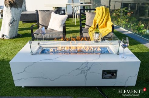 White marble ceramic table as a luxury gas fireplace + decorative glass